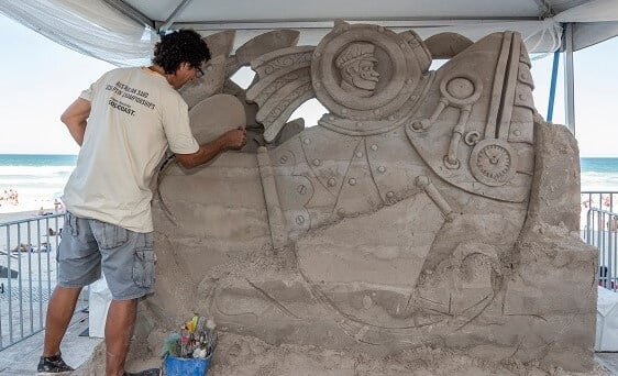 Artist working on  Sand Sculpture in the Sand Sculpture Championships in Queensland